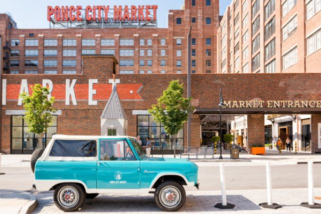 Leon, the 1967 Classic Ford Bronco parked in front of Ponce City Market.